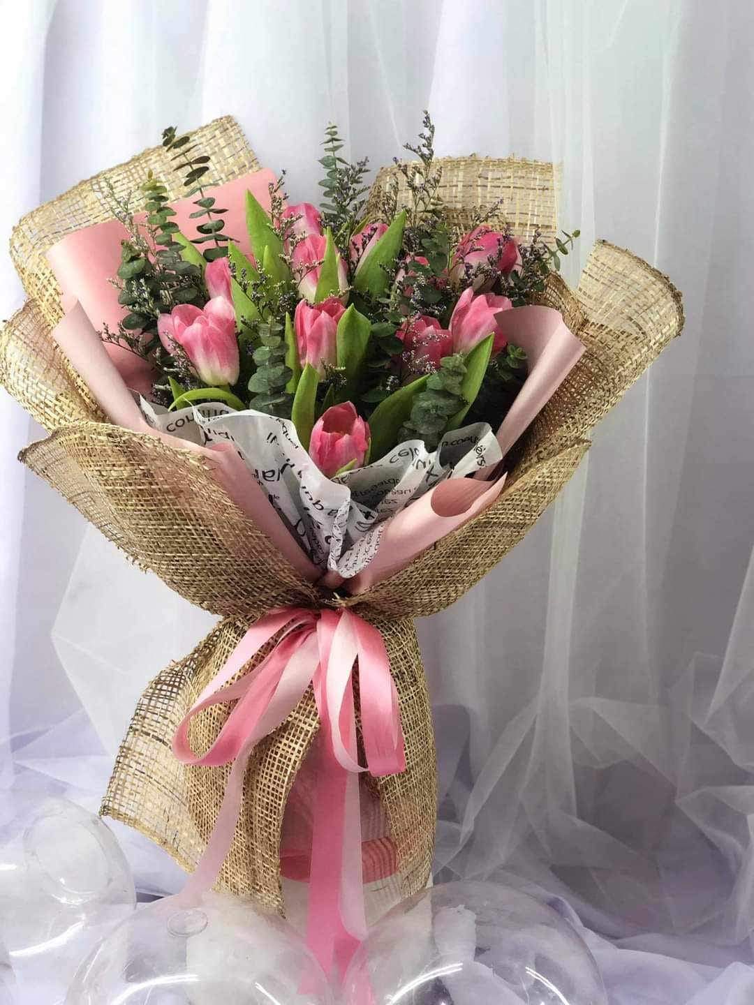 pink tulip hand bouquet with jute wrap