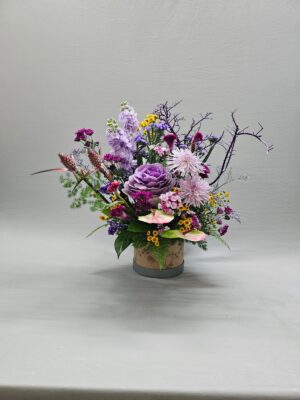 Luxury round flower box arrangement with purple flowers