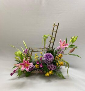 Artistic Floral Ladder Arrangement with Pink Lilies