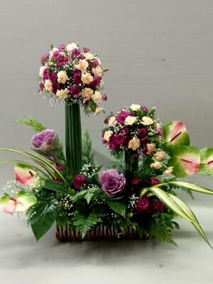 Elegant side flower arrangement with carnations and anthuriums