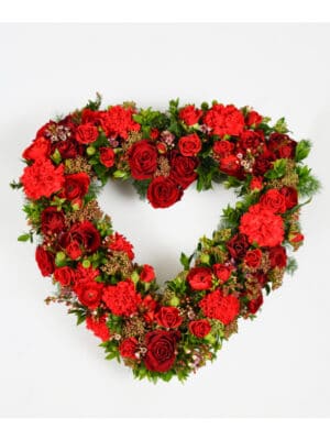 same-day flowers delivery Heart shaped floral arrangement made with fresh red roses, red carnations and seasonal greenery.