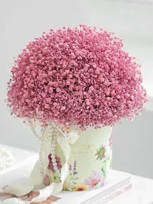 Pink Baby's Breath Gypsophila flower arrangement in decorative floral hat box