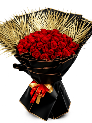 Luxury bouquet fresh red roses with black wrapping and golden palm leaves