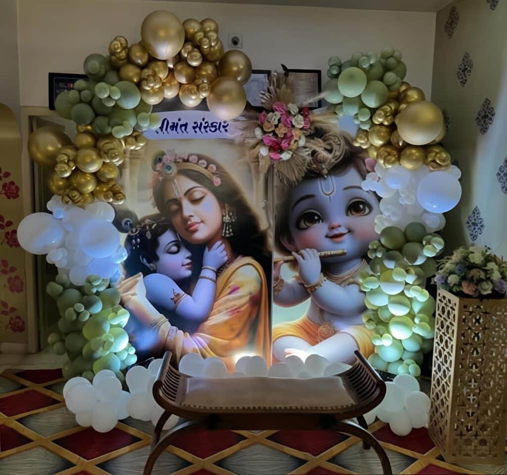Krishna Janmashtami decoration with green, gold and white balloon arch and Krishna backdrop